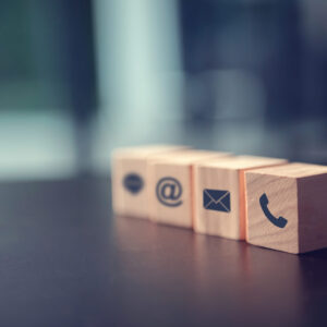 contact-us-concept-wood-block-symbol-telephone-mail-and-address-on-desk